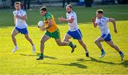 17 June 2023; Caolan McGonagle of Donegal in action against Monaghan players, from left, Karl Gallagher, Conor Boyle, and Conor McCarthy during the GAA Football All-Ireland Senior Championship Round 3 match between Monaghan and Donegal at O'Neills Healy Park in Omagh, Tyrone. Photo by Ramsey Cardy/Sportsfile