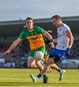 17 June 2023; Jack McCarron of Monaghan in action against Hugh McFadden of Donegal during the GAA Football All-Ireland Senior Championship Round 3 match between Monaghan and Donegal at O'Neills Healy Park in Omagh, Tyrone. Photo by Ramsey Cardy/Sportsfile