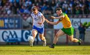 17 June 2023; Michael Bannigan of Monaghan in action against Mark Curran of Donegal during the GAA Football All-Ireland Senior Championship Round 3 match between Monaghan and Donegal at O'Neills Healy Park in Omagh, Tyrone. Photo by Ramsey Cardy/Sportsfile