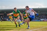 17 June 2023; Jack McCarron of Monaghan in action against Hugh McFadden of Donegal during the GAA Football All-Ireland Senior Championship Round 3 match between Monaghan and Donegal at O'Neills Healy Park in Omagh, Tyrone. Photo by Ramsey Cardy/Sportsfile