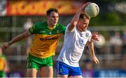 17 June 2023; Ryan McAnespie of Monaghan in action against Caolan McColgan of Donegal during the GAA Football All-Ireland Senior Championship Round 3 match between Monaghan and Donegal at O'Neills Healy Park in Omagh, Tyrone. Photo by Ramsey Cardy/Sportsfile