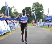 18 June 2023; Peter Somba of Dunboyne AC, Meath, crosses the line to win the 2023 Irish Life Dublin Race Series – Corkagh Park 5 Mile at Corkagh Park in Clondalkin, Dublin. Photo by Sam Barnes/Sportsfile
