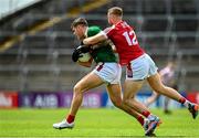 18 June 2023; Jordan Flynn of Mayo in action against Killian O'Hanlon of Cork during the GAA Football All-Ireland Senior Championship Round 3 match between Cork and Mayo at TUS Gaelic Grounds in Limerick. Photo by Eóin Noonan/Sportsfile