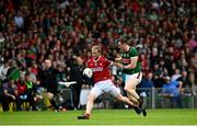 18 June 2023; Ruairi Deane of Cork in action against Matthew Ruane of Mayo during the GAA Football All-Ireland Senior Championship Round 3 match between Cork and Mayo at TUS Gaelic Grounds in Limerick. Photo by Eóin Noonan/Sportsfile