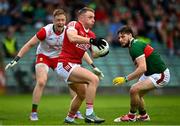 18 June 2023; Brian Hurley of Cork in action against Pádraig O’Hora of Mayo, right, and Mayo manager Colm Reape during the GAA Football All-Ireland Senior Championship Round 3 match between Cork and Mayo at TUS Gaelic Grounds in Limerick. Photo by Eóin Noonan/Sportsfile