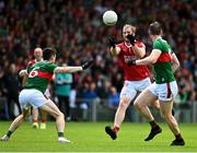 18 June 2023;Ruairi Deane of Cork in action against Conor Loftus, left, and Matthew Ruane of Mayo during the GAA Football All-Ireland Senior Championship Round 3 match between Cork and Mayo at TUS Gaelic Grounds in Limerick. Photo by Eóin Noonan/Sportsfile