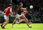 18 June 2023; Jordan Flynn of Mayo in action against Sean Powter of Cork during the GAA Football All-Ireland Senior Championship Round 3 match between Cork and Mayo at TUS Gaelic Grounds in Limerick. Photo by Eóin Noonan/Sportsfile