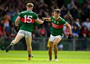 18 June 2023; Tommy Conroy of Mayo celebrates with teammate Ryan O'Donoghue after scoring his side's first goal during the GAA Football All-Ireland Senior Championship Round 3 match between Cork and Mayo at TUS Gaelic Grounds in Limerick. Photo by Eóin Noonan/Sportsfile