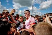 18 June 2023; Seán O'Shea of Kerry poses for pictures with supporters after during the GAA Football All-Ireland Senior Championship Round 3 match between Kerry and Louth at Laois Hire O'Moore Park in Portaloise, Laois. Photo by Michael P Ryan/Sportsfile