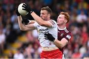 18 June 2023; Brian Kennedy of Tyrone in action against Ronan Wallace of Westmeath during the GAA Football All-Ireland Senior Championship Round 3 match between Tyrone and Westmeath at Kingspan Breffni in Cavan. Photo by Ramsey Cardy/Sportsfile