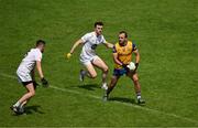 18 June 2023; Donie Smith of Roscommon in action against David Hyland, left, and Kevin Flynn of Kildare during the GAA Football All-Ireland Senior Championship Round 3 match between Roscommon and Kildare at Glenisk O'Connor Park in Tullamore, Offaly. Photo by Daire Brennan/Sportsfile