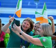 17 June 2023; Supporters of Team Ireland's Margaret Turley, a member of Sports Club 15, from Kilkenny City, Áine and Sorcha Turley and Miriam Cronin take a selfie during the World Special Olympic Games 2023 Opening Ceremony in the Olympiastadion Berlin, Germany. Photo by Ray McManus/Sportsfile