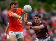 18 June 2023; Jason Duffy of Armagh in action against Cathal Sweeney of Galway during the GAA Football All-Ireland Senior Championship Round 3 match between Galway and Armagh at Avant Money Páirc Seán Mac Diarmada in Carrick-on-Shannon, Leitrim. Photo by Harry Murphy/Sportsfile