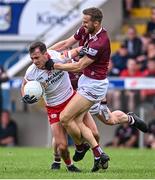 18 June 2023; Darragh Canavan of Tyrone in action against Kevin Maguire of Westmeath during the GAA Football All-Ireland Senior Championship Round 3 match between Tyrone and Westmeath at Kingspan Breffni in Cavan. Photo by Ramsey Cardy/Sportsfile