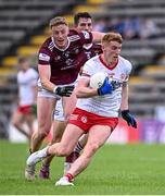 18 June 2023; Peter Harte of Tyrone in action against Ray Connellan of Westmeath during the GAA Football All-Ireland Senior Championship Round 3 match between Tyrone and Westmeath at Kingspan Breffni in Cavan. Photo by Ramsey Cardy/Sportsfile