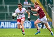 18 June 2023; Pádraig Hampsey of Tyrone in action against Ronan Wallace of Westmeath during the GAA Football All-Ireland Senior Championship Round 3 match between Tyrone and Westmeath at Kingspan Breffni in Cavan. Photo by Ramsey Cardy/Sportsfile
