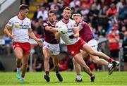 18 June 2023; Brian Kennedy of Tyrone in action against Andy McCormack, left, and Luke Loughlin of Westmeath during the GAA Football All-Ireland Senior Championship Round 3 match between Tyrone and Westmeath at Kingspan Breffni in Cavan. Photo by Ramsey Cardy/Sportsfile