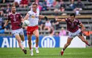 18 June 2023; Conn Kilpatrick of Tyrone in action against Kevin Maguire, left, and David Lynch of Westmeath during the GAA Football All-Ireland Senior Championship Round 3 match between Tyrone and Westmeath at Kingspan Breffni in Cavan. Photo by Ramsey Cardy/Sportsfile