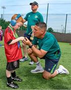 18 June 2023; FAI regional development officer Marc Kenny presents medals to players after the Football For All National Blitz on the Sport Ireland Campus in Dublin. Photo by Seb Daly/Sportsfile