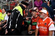 18 June 2023; An Armagh supporter is spoken to by a member of An Garda Síochána during the GAA Football All-Ireland Senior Championship Round 3 match between Galway and Armagh at Avant Money Páirc Seán Mac Diarmada in Carrick-on-Shannon, Leitrim. Photo by Harry Murphy/Sportsfile