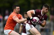 18 June 2023; Johnny Heaney of Galway in action against Aidan  Forker of Armagh during the GAA Football All-Ireland Senior Championship Round 3 match between Galway and Armagh at Avant Money Páirc Seán Mac Diarmada in Carrick-on-Shannon, Leitrim. Photo by Harry Murphy/Sportsfile