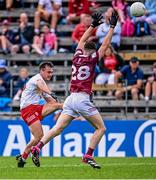 18 June 2023; Darragh Canavan of Tyrone kicks a point under pressure from James Dolan of Westmeath during the GAA Football All-Ireland Senior Championship Round 3 match between Tyrone and Westmeath at Kingspan Breffni in Cavan. Photo by Ramsey Cardy/Sportsfile