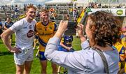 18 June 2023; Evelyn McNally takes a picture of her nephew Eoin McCormack of Roscommon with her niece's boyfriend Daniel Flynn of Kildare after the GAA Football All-Ireland Senior Championship Round 3 match between Roscommon and Kildare at Glenisk O'Connor Park in Tullamore, Offaly. Photo by Daire Brennan/Sportsfile