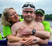 19 June 2023; Team Ireland's Eoin O'Connell, a member of D6 Special Olympics Club, from Dundrum, Dublin, with his mother and father, Marie and George, after the Open Water Swim 1,500m on day three of the World Special Olympic Games 2023 at the Grünau regatta course in Berlin, Germany. Photo by Ray McManus/Sportsfile