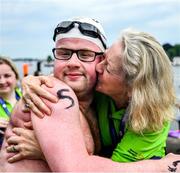 19 June 2023; Team Ireland's Eoin O'Connell, a member of D6 Special Olympics Club, from Dundrum, Dublin, with his mother Marie after the Open Water Swim 1,500m on day three of the World Special Olympic Games 2023 at the Grünau regatta course in Berlin, Germany. Photo by Ray McManus/Sportsfile