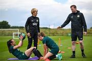 19 June 2023; Áine O'Gorman, left, and Abbie Larkin with manager Vera Pauw and assistant manager Tom Elmes during a Republic of Ireland women training session at the FAI National Training Centre in Abbotstown, Dublin. Photo by Harry Murphy/Sportsfile
