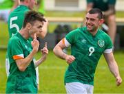 19 June 2023; 19 June 2023; Team Ireland's James Meenan, right, a member of Newry City Special Olympics Club, from Dundalk, Louth, who scored the first goal, celebrates with team mate Ray Singleton, a member of Eagles Special Olympics Club, from Aughnacloy, Tyrone, after he scored the second goal during the qualifier match between Ireland and Uganda on day three of the World Special Olympic Games 2023 at The Mayfield in the Olympiapark in Berlin, Germany.