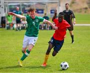 19 June 2023; Team Ireland's Eamon Quinn, a member of Eagles Special Olympics Club, from Cookstown, Tyrone, in action against Jacob Eliya of Uganda during the qualifier match between Ireland and Uganda on day three of the World Special Olympic Games 2023 at The Mayfield in the Olympiapark in Berlin, Germany. Photo by Ray McManus/Sportsfile