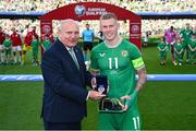 19 June 2023; Republic of Ireland captain James McClean is presented with his medal and 100th cap from FAI President Gerry McAnaney before the UEFA EURO 2024 Championship qualifying group B match between Republic of Ireland and Gibraltar at the Aviva Stadium in Dublin. Photo by Stephen McCarthy/Sportsfile