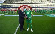 19 June 2023; Republic of Ireland captain James McClean is presented with his medal and 100th cap from FAI President Gerry McAnaney before the UEFA EURO 2024 Championship qualifying group B match between Republic of Ireland and Gibraltar at the Aviva Stadium in Dublin. Photo by Stephen McCarthy/Sportsfile