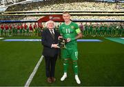 19 June 2023; Republic of Ireland captain James McClean, on the occassion of his 100th international cap, with the President of Ireland Michael D Higgins, before the UEFA EURO 2024 Championship qualifying group B match between Republic of Ireland and Gibraltar at the Aviva Stadium in Dublin. Photo by Stephen McCarthy/Sportsfile