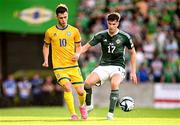 19 June 2023; Maxim Samorodov of Kazakhstan in action against Paddy McNair of Northern Ireland during the UEFA EURO 2024 Championship Qualifier match between Northern Ireland and Kazakhstan at National Stadium at Windsor Park in Belfast. Photo by Ramsey Cardy/Sportsfile