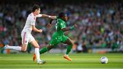 19 June 2023; Michael Obafemi of Republic of Ireland in action against Louie Annesley of Gibraltar during the UEFA EURO 2024 Championship qualifying group B match between Republic of Ireland and Gibraltar at the Aviva Stadium in Dublin. Photo by Seb Daly/Sportsfile