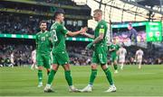 19 June 2023; Jamie McGrath, left, and James McClean of Republic of Ireland celebrate after during the UEFA EURO 2024 Championship qualifying group B match between Republic of Ireland and Gibraltar at the Aviva Stadium in Dublin. Photo by Seb Daly/Sportsfile