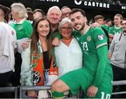 19 June 2023; Mikey Johnston of Republic of Ireland with his family, from left, sister Joanne, dad Robert, and mum Janette after the UEFA EURO 2024 Championship qualifying group B match between Republic of Ireland and Gibraltar at the Aviva Stadium in Dublin. Photo by Michael P Ryan/Sportsfile