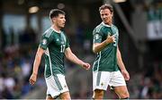 19 June 2023; Paddy McNair, left, and Jonny Evans of Northern Ireland during the UEFA EURO 2024 Championship Qualifier match between Northern Ireland and Kazakhstan at National Stadium at Windsor Park in Belfast. Photo by Ramsey Cardy/Sportsfile