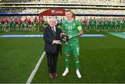 19 June 2023; President of Ireland Michael D Higgins makes a presentation to James McClean of Republic of Ireland, on the occasion of his 100th international cap, before the UEFA EURO 2024 Championship qualifying group B match between Republic of Ireland and Gibraltar at the Aviva Stadium in Dublin. Photo by Stephen McCarthy/Sportsfile