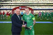 19 June 2023; FAI President Gerry McAnaney makes a presentation to James McClean of Republic of Ireland, on the occasion of his 100th international cap, before the UEFA EURO 2024 Championship qualifying group B match between Republic of Ireland and Gibraltar at the Aviva Stadium in Dublin. Photo by Stephen McCarthy/Sportsfile