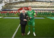 19 June 2023; President of Ireland Michael D Higgins makes a presentation to James McClean of Republic of Ireland, on the occasion of his 100th international cap, before the UEFA EURO 2024 Championship qualifying group B match between Republic of Ireland and Gibraltar at the Aviva Stadium in Dublin. Photo by Stephen McCarthy/Sportsfile