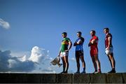 20 June 2023; In attendance at the 2023 GAA Football All-Ireland Series national launch in Howth, Dublin, are from left, Gavin White of Kerry with the Sam Maguire cup, Cormac Costello of Dublin, Conor Glass of Derry and Matthew Tierney of Galway. Photo by Brendan Moran/Sportsfile