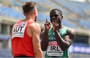 20 June 2023; Israel Olatunde of Ireland, right, reacts as Markus Fuchs of Austria, left, finishes first after the Men's 100m at the Silesian Stadium during the European Games 2023 in Chorzow, Poland. Photo by Tyler Miller/Sportsfile