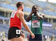 20 June 2023; Israel Olatunde of Ireland, right, reacts as Markus Fuchs of Austria, left, finishes first after the Men's 100m at the Silesian Stadium during the European Games 2023 in Chorzow, Poland. Photo by Tyler Miller/Sportsfile