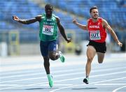 20 June 2023; Markus Fuchs of Austria, right, crosses the line to finish first and Israel Olatunde of Ireland, left, crosses the line to finish second in the Men's 100m at the Silesian Stadium during the European Games 2023 in Chorzow, Poland. Photo by Tyler Miller/Sportsfile