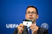 20 June 2023; UEFA Head of Club Competitions & Calendar Tobias Hedtstück draws out the card of '2' during UEFA Europa Conference League 2023/24 First Qualifying Round Draw at the UEFA headquarters, in Nyon, Switzerland. Photo by Kristian Skeie - UEFA via Sportsfile