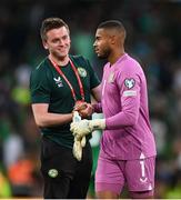 19 June 2023; Republic of Ireland goalkeeper Gavin Bazunu and Kieran Crowley, FAI communications manager, left, after the UEFA EURO 2024 Championship qualifying group B match between Republic of Ireland and Gibraltar at the Aviva Stadium in Dublin. Photo by Stephen McCarthy/Sportsfile