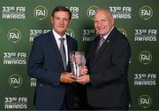 20 June 2023; Kevin Moran is presented with the Hall of Fame award by FAI President Gerry McAnaney during the FAI 33rd International Awards media event at Mansion House in Dublin. Photo by Stephen McCarthy/Sportsfile